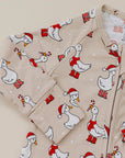 Children's hoodie with Christmas duck pattern on a beige background