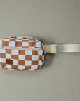 Checkered pattern waist bag with a strap on a beige background