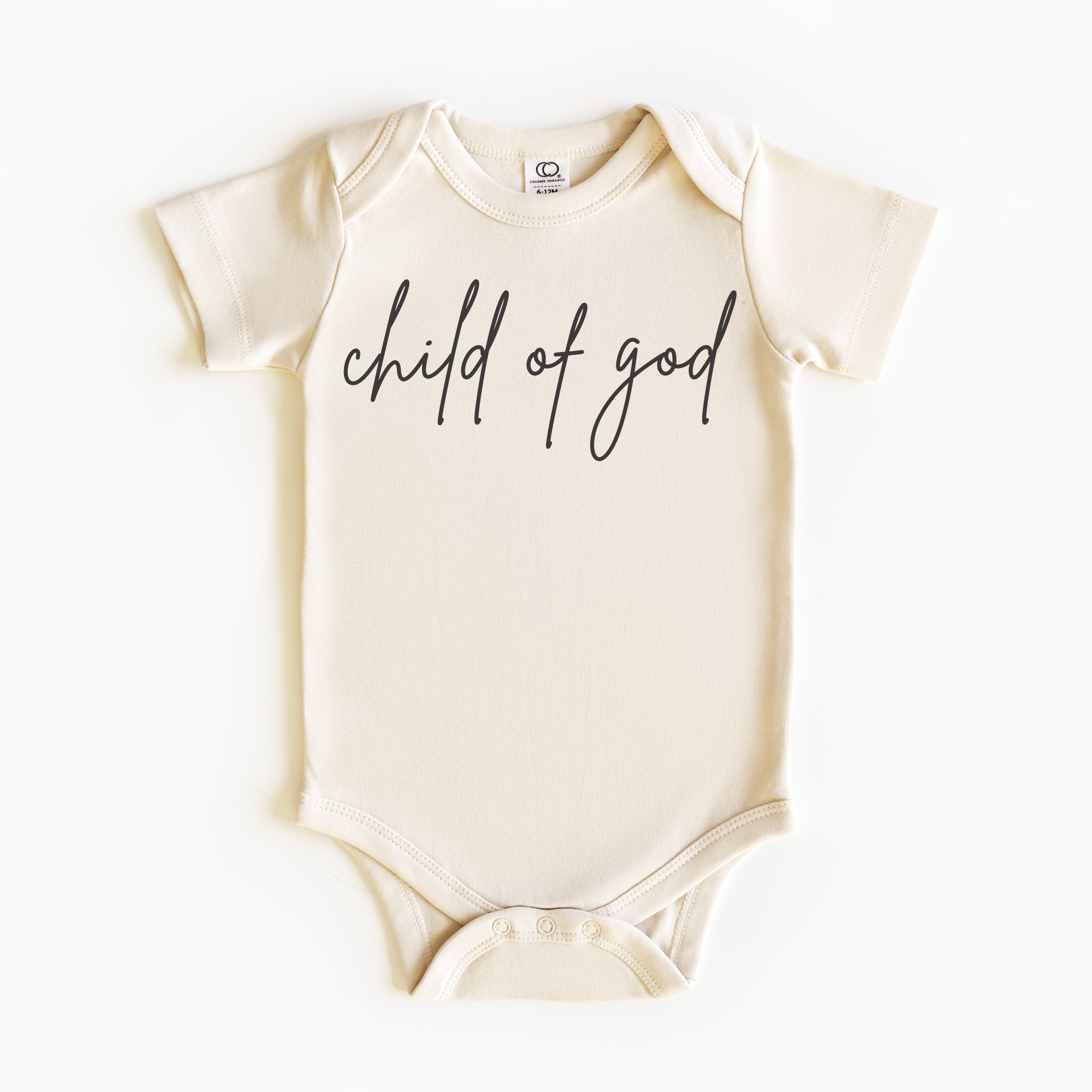 Baby wearing “Child of God” affirmation bodysuit – Christian script design organic cotton outfit by Lumiere Vive
