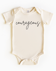 Baby wearing “Courageous” affirmation bodysuit – Christian script design organic cotton outfit by Lumiere Vive