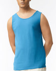 Man wearing a blue tank top against a white background