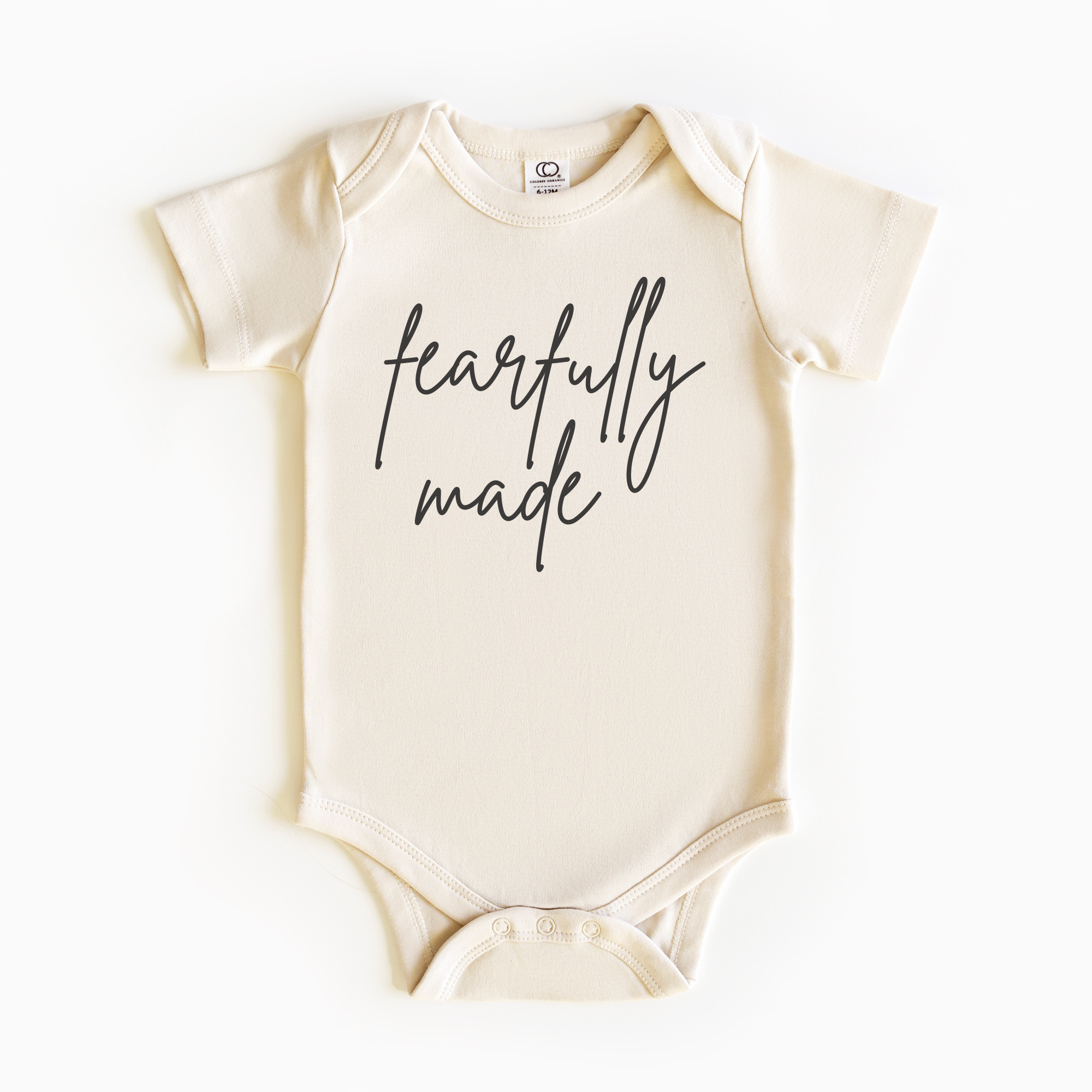 Baby wearing “Fearfully Made” affirmation bodysuit – Christian script design organic cotton outfit by Lumiere Vive