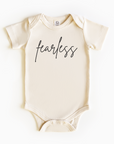 Baby wearing “Fearless” affirmation bodysuit – Christian script design organic cotton outfit by Lumiere Vive