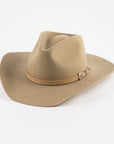 Tan cowboy hat with a band on a white background