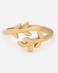 Gold branch-shaped ring on a white background