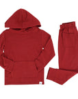 Red hoodie and pants set on a white background