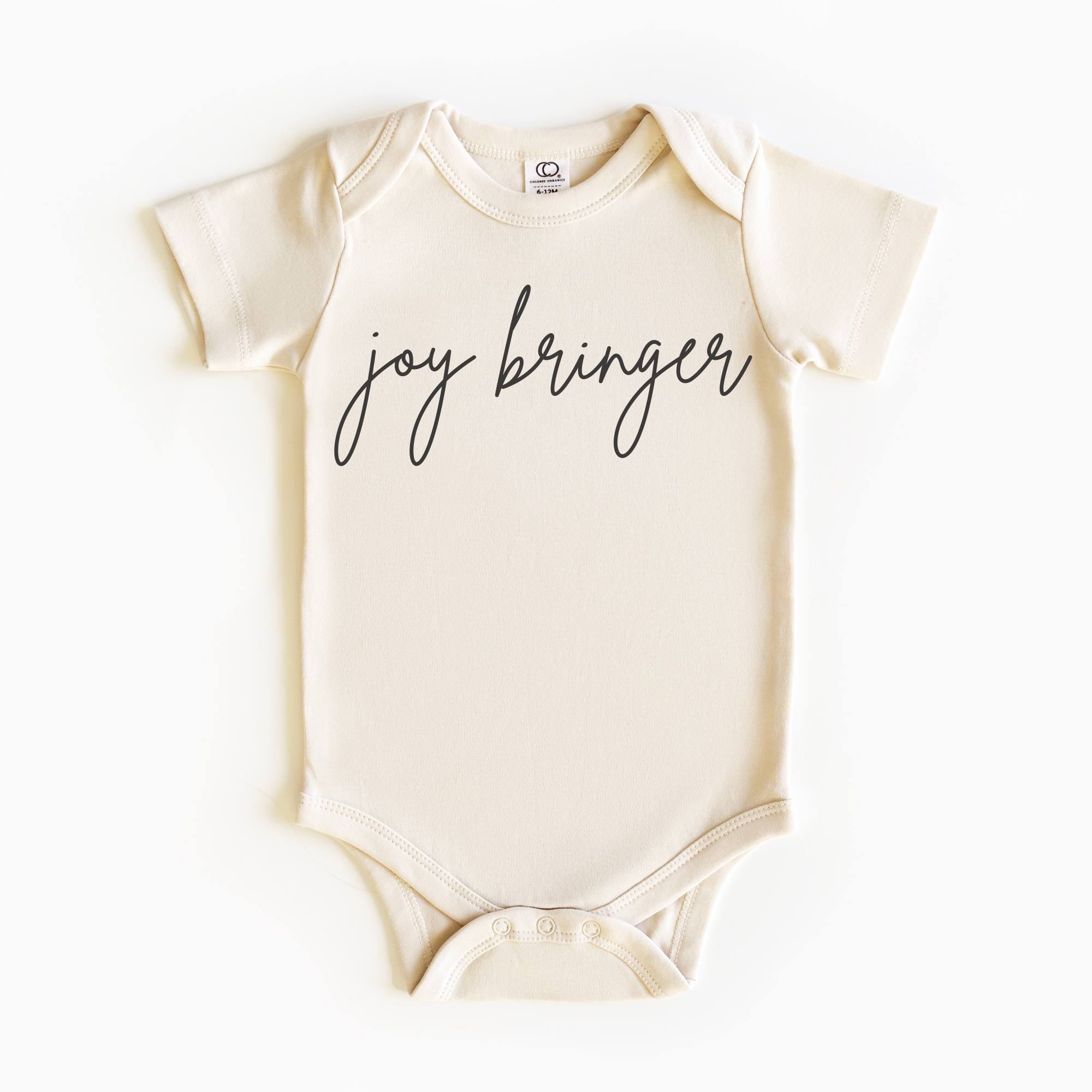 Baby wearing “Joy Bringer” affirmation bodysuit – Christian script design organic cotton outfit by Lumiere Vive