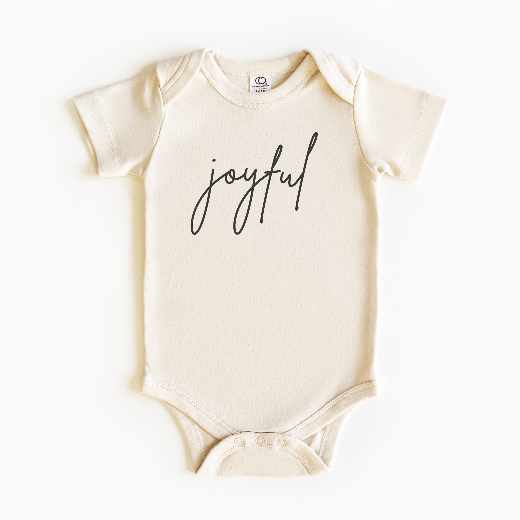 Baby wearing “Joyful” affirmation bodysuit – Christian script design organic cotton outfit by Lumiere Vive