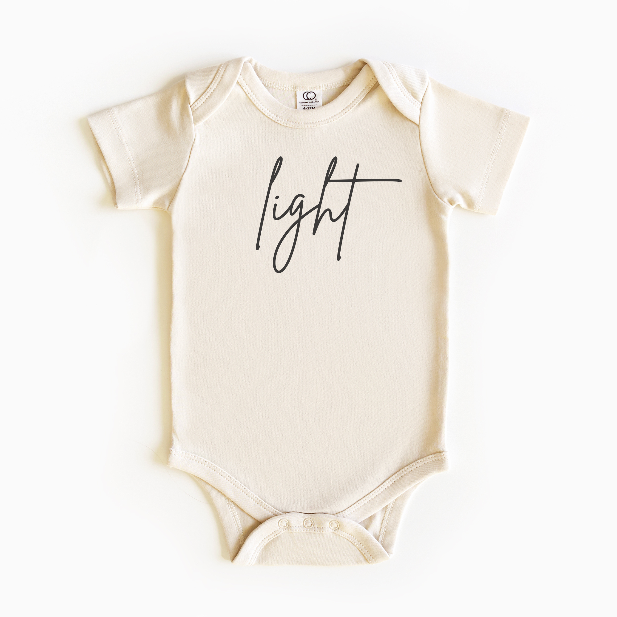 Baby wearing “Light” affirmation bodysuit – Christian script design organic cotton outfit by Lumiere Vive