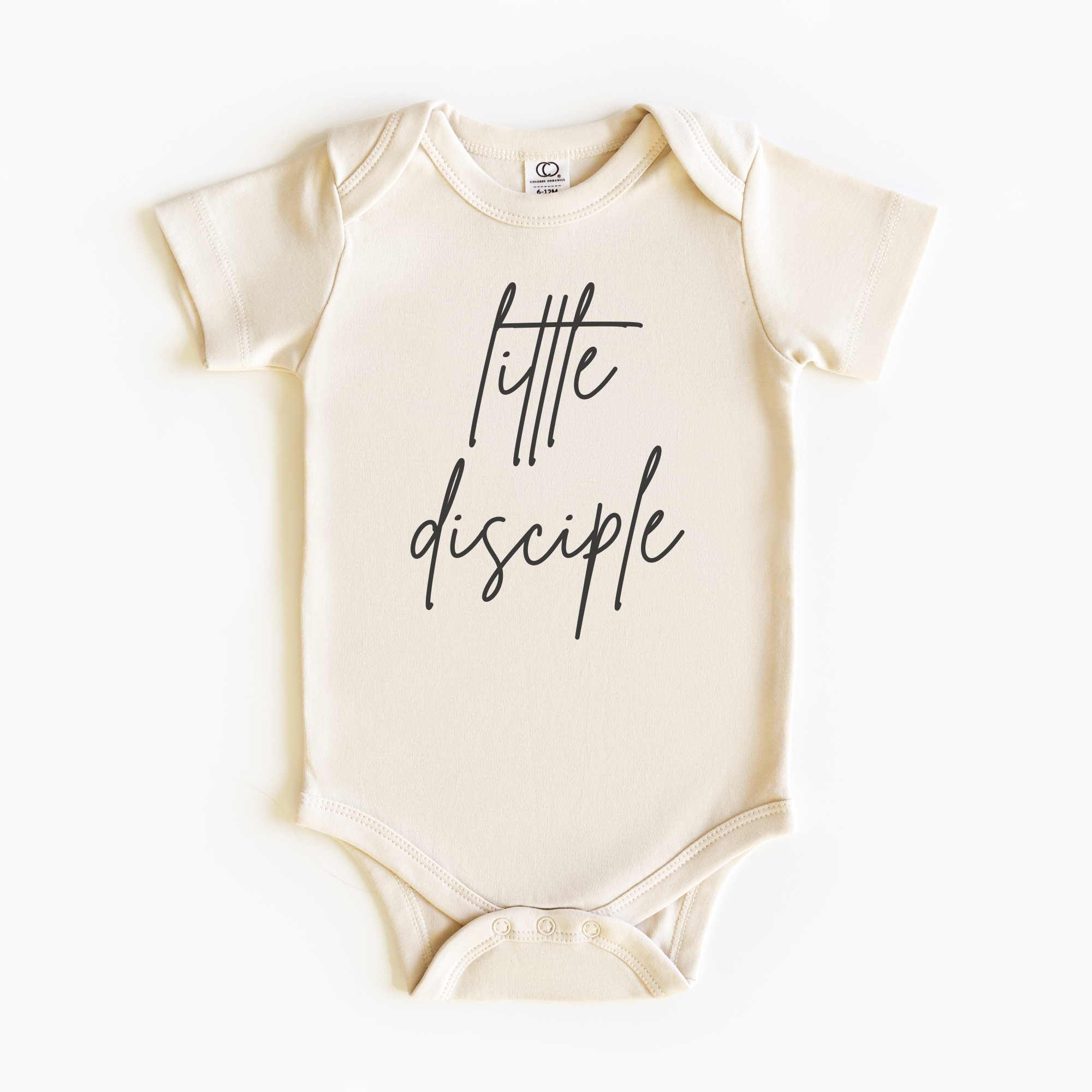 Baby wearing “Little Disciple” affirmation bodysuit – Christian script design organic cotton outfit by Lumiere Vive