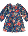 Front view of the Midnight Bloom girls’ dress with a rich blue floral print, rounded collar, and gathered skirt.