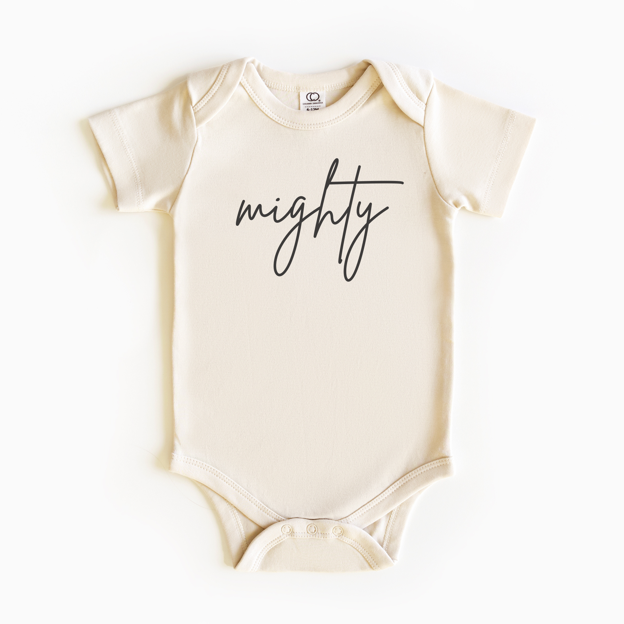 Baby wearing “Mighty” affirmation bodysuit – Christian script design organic cotton outfit by Lumiere Vive