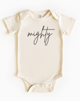 Baby wearing “Mighty” affirmation bodysuit – Christian script design organic cotton outfit by Lumiere Vive