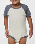 Infant wearing a natural and granite heather Rabbit Skins 4430 raglan baseball bodysuit, front view, ideal for custom printing