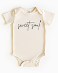 Baby wearing “Sweet Soul” affirmation bodysuit – Christian script design organic cotton outfit by Lumiere Vive