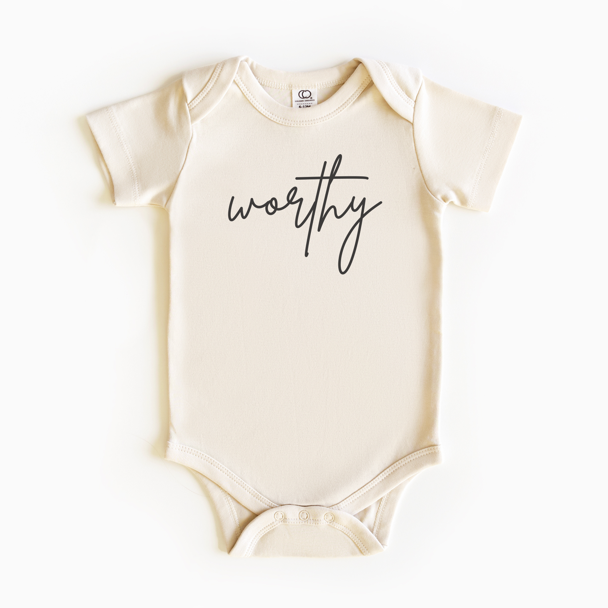Baby wearing “Worthy” affirmation bodysuit – Christian script design organic cotton outfit by Lumiere Vive