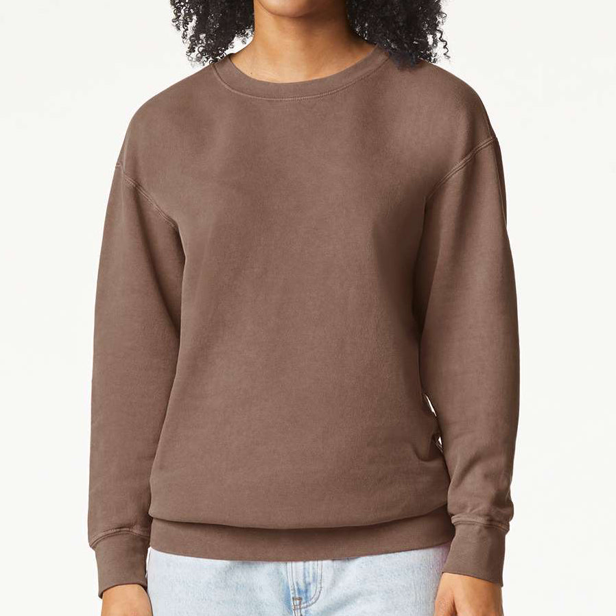 Woman wearing a brown Comfort Colors garment-dyed crewneck sweatshirt with a relaxed fit — ideal for custom prints, embroidery, or cozy everyday wear by Lumiere Vive.