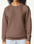 Woman wearing a brown Comfort Colors garment-dyed crewneck sweatshirt with a relaxed fit — ideal for custom prints, embroidery, or cozy everyday wear by Lumiere Vive.