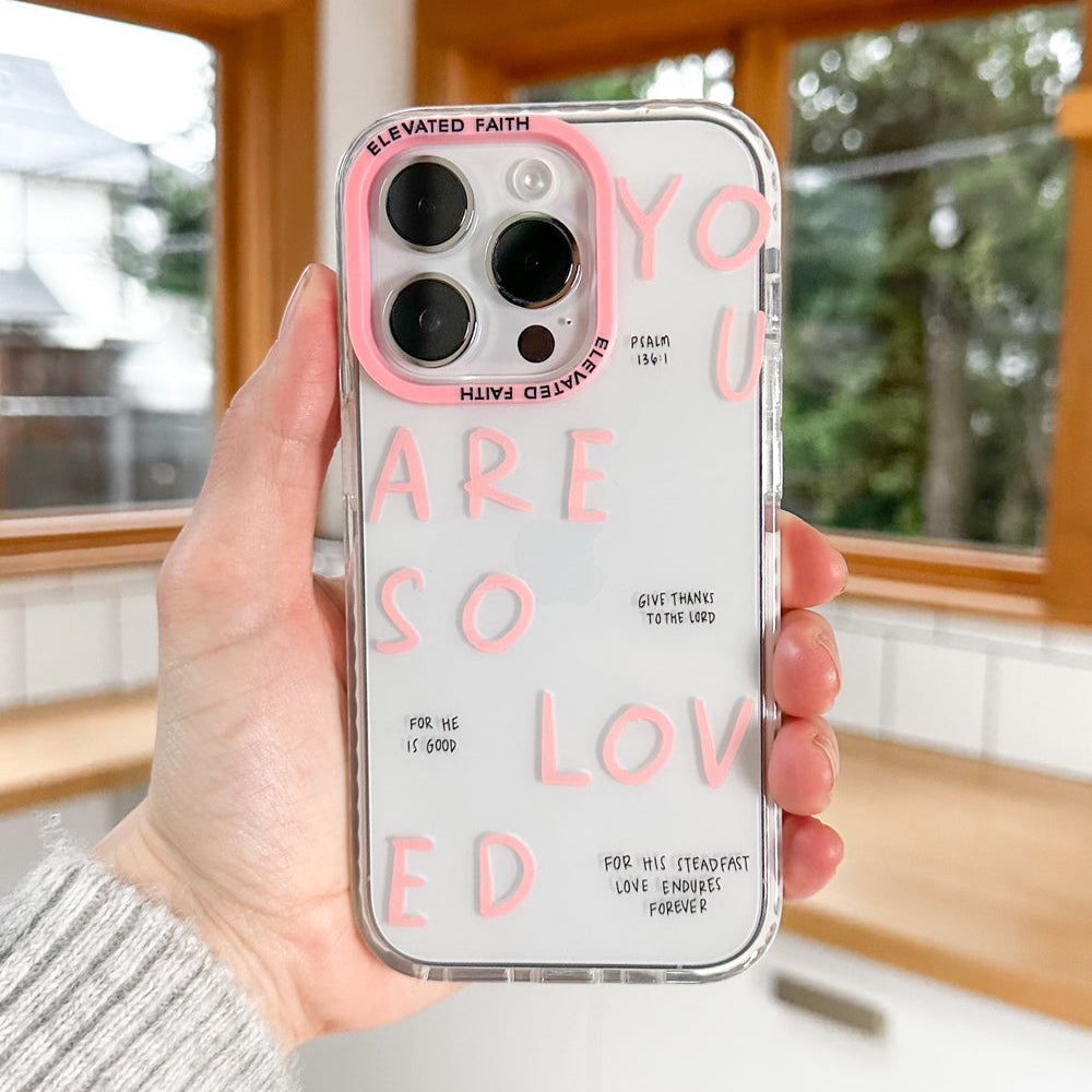 Phone case with motivational text held by a person indoors