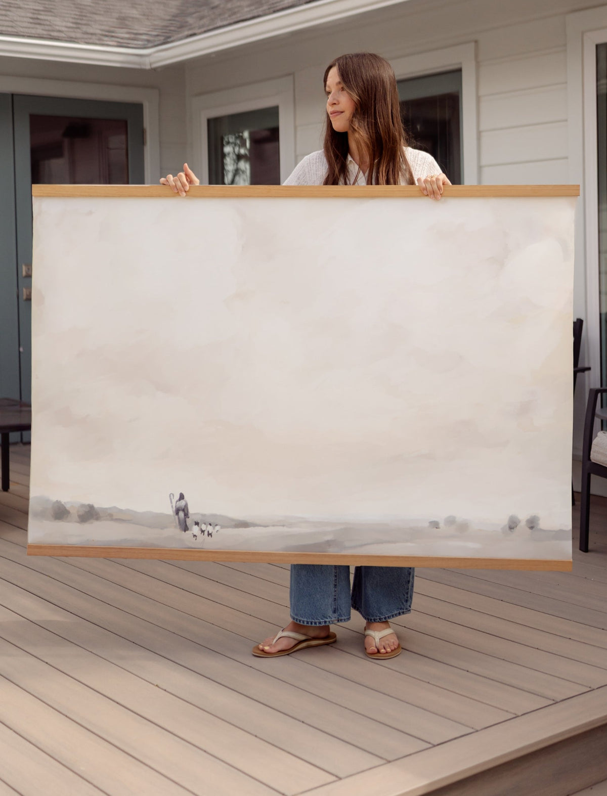 Jesus Is My Shepherd 60 × 40-inch canvas wall hanging held on a deck to show its large horizontal size