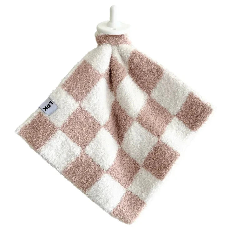 Checkered towel with pink and white pattern on a white background