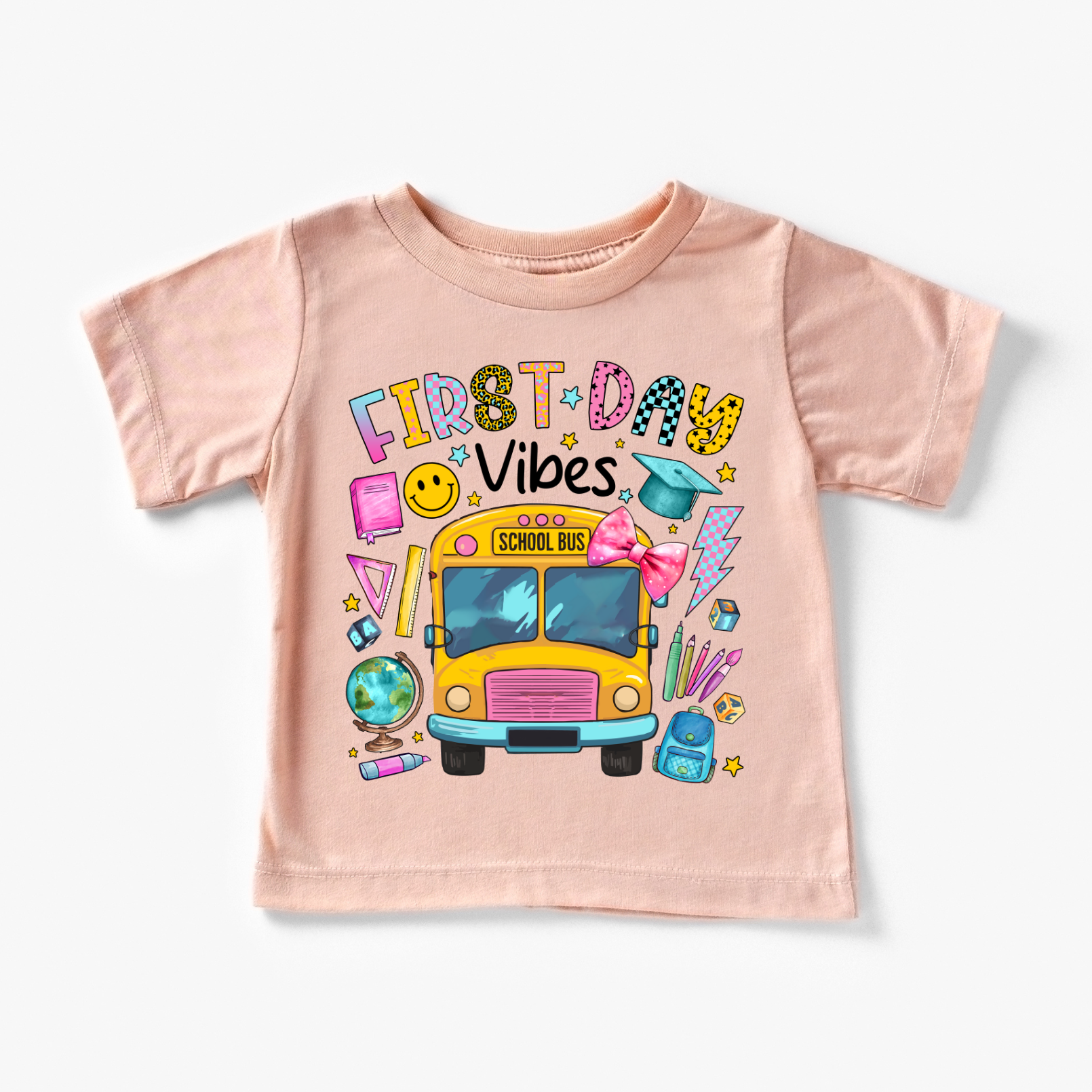 Pink t-shirt with colorful graphics and text on a white background