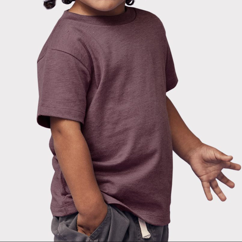 Toddler boy wearing a plum Bella + Canvas Jersey T-Shirt with a soft, relaxed fit — ideal for custom printing and everyday comfort by Lumiere Vive.