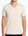 Male model wearing a natural-colored Bella + Canvas 3005CVC V-Neck T-Shirt on a white studio background — soft cotton-poly blank ideal for custom printing by Lumiere Vive.