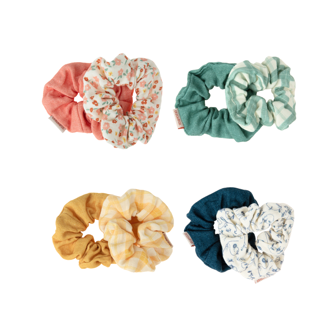 Set of six colorful scrunchies on a white background