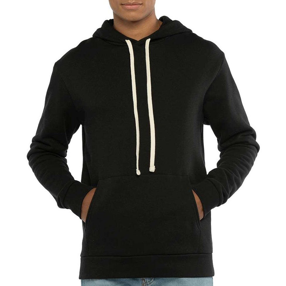 Black male model wearing a black Next Level 9303 Unisex Hoodie on a neutral beige studio background — premium fleece blank ideal for custom printing by Lumiere Vive.