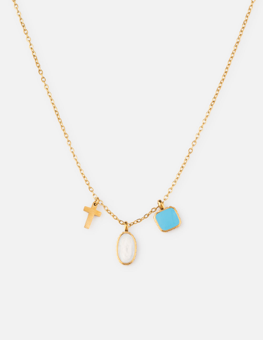 Ascend Charm Link Necklace with a gold-tone chain, cross charm, light-colored oval charm, and blue charm