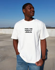 Model wearing cream Ask Me About Jesus heavyweight tee with jeans