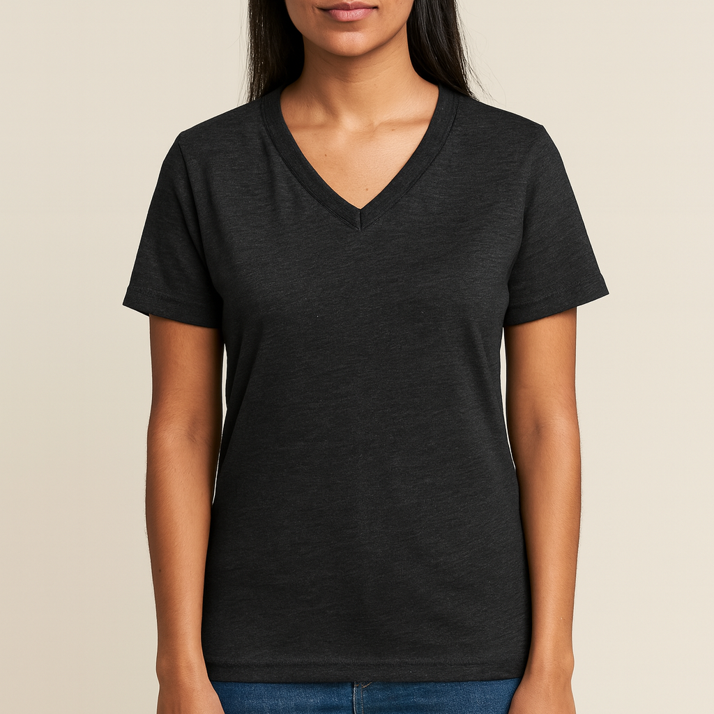 Indian female model wearing a dark gray Bella + Canvas V-Neck T-Shirt on a light tan background — soft cotton-poly blank ideal for custom printing by Lumiere Vive.
