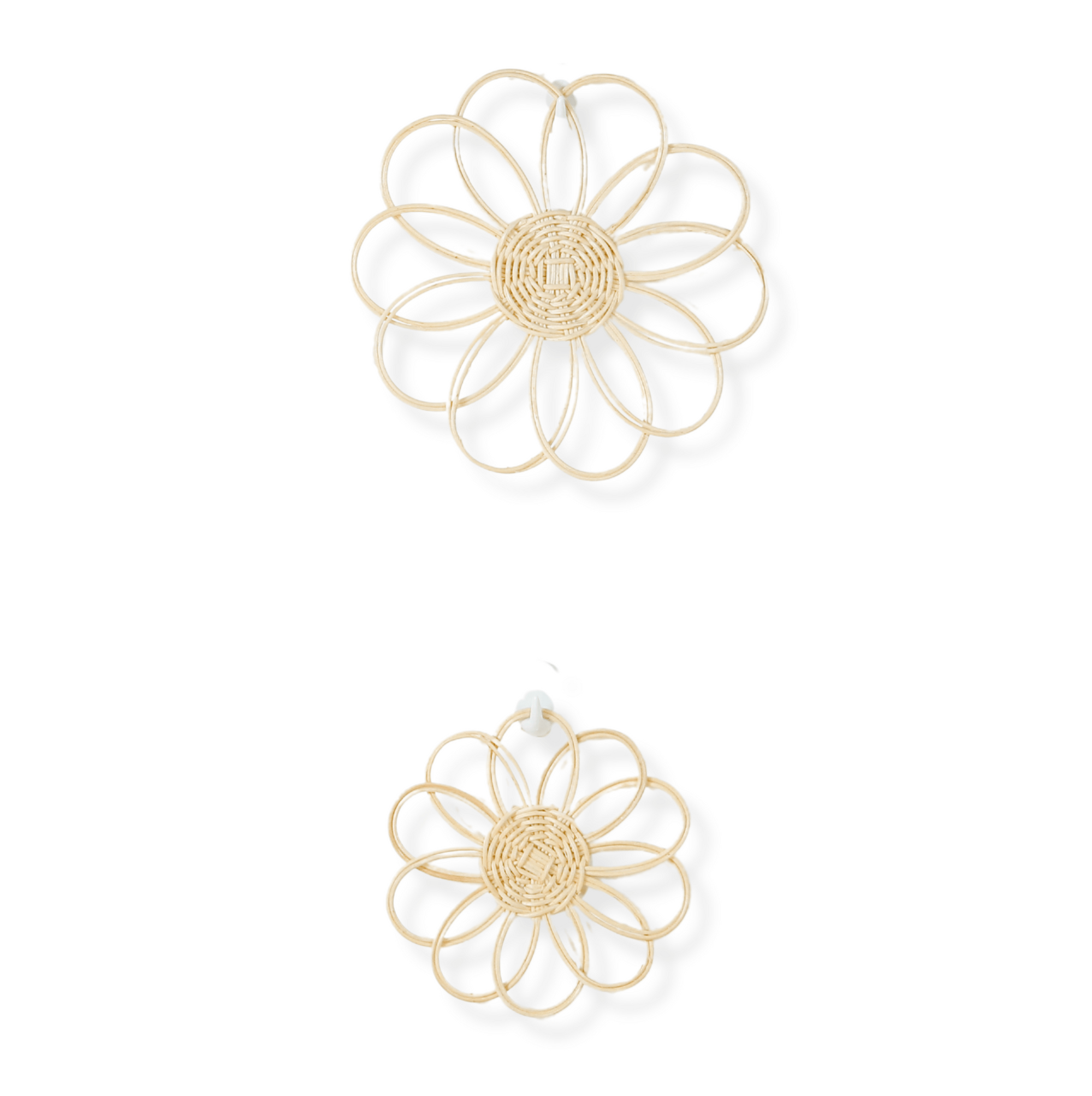 Pair of gold floral earrings on a white background