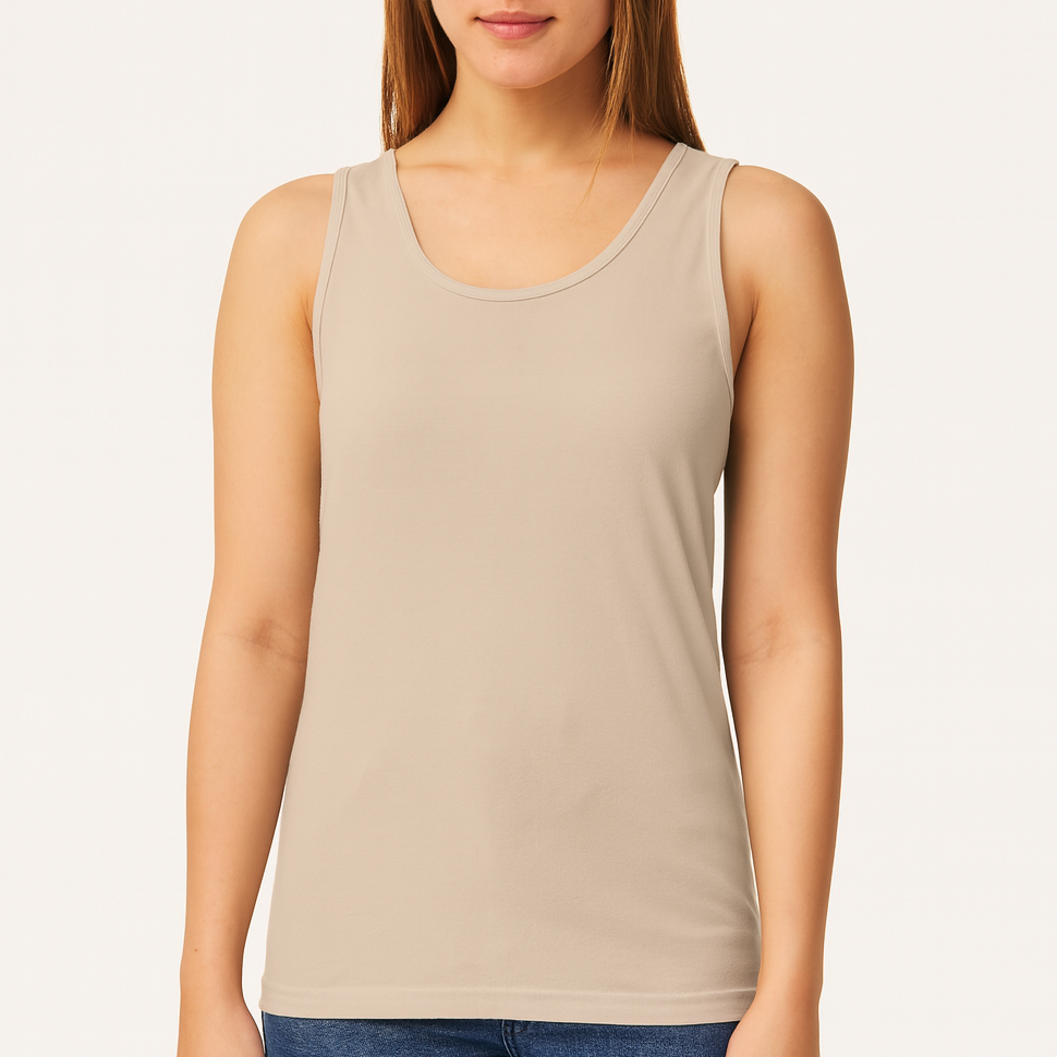 Female model wearing a neutral sandstone Comfort Colors C9360 Garment-Dyed Tank on a beige background — soft cotton tank ideal for custom printing by Lumiere Vive.