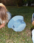 Child of God patchwork denim bucket hat with star appliqués photographed outdoors