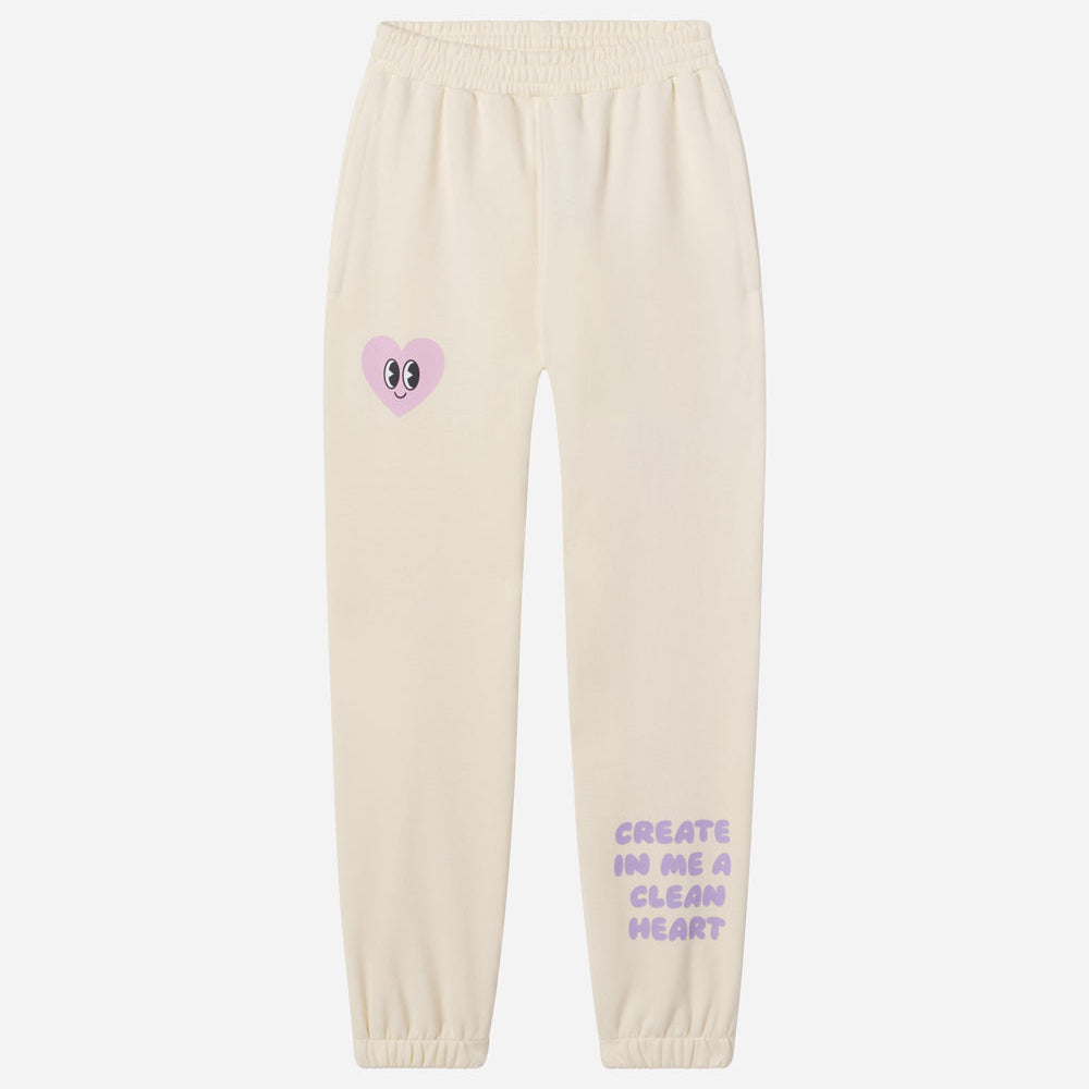 Beige sweatpants with a heart design and text on a white background