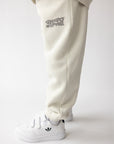 Child wearing Moonstone sweatpants with a coordinating sweatshirt outdoors on a dirt path