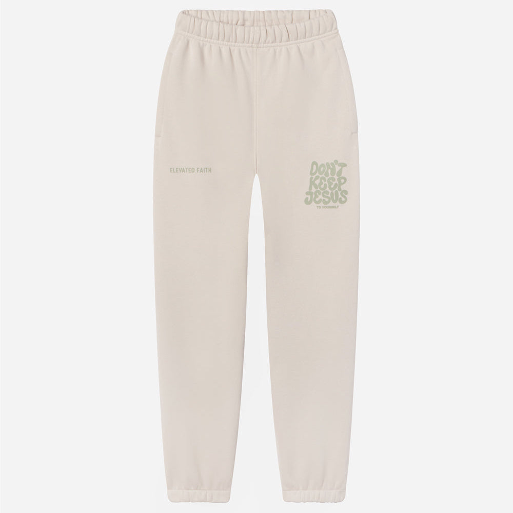 Beige sweatpants with text on a white background