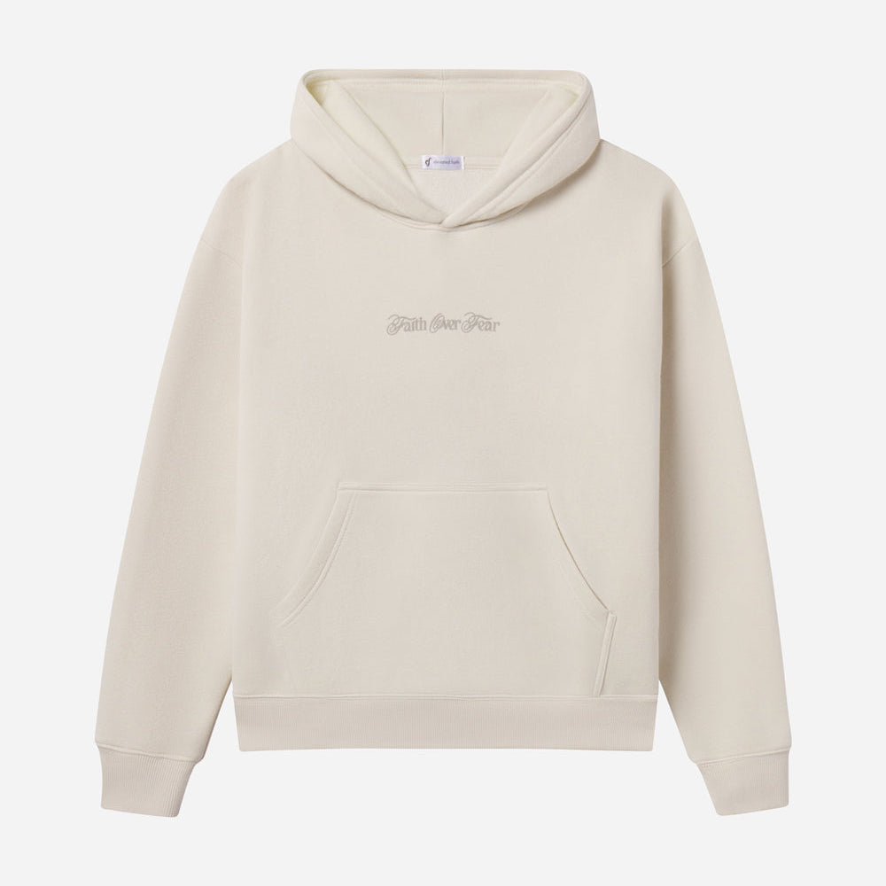 Beige hoodie with text on a white background