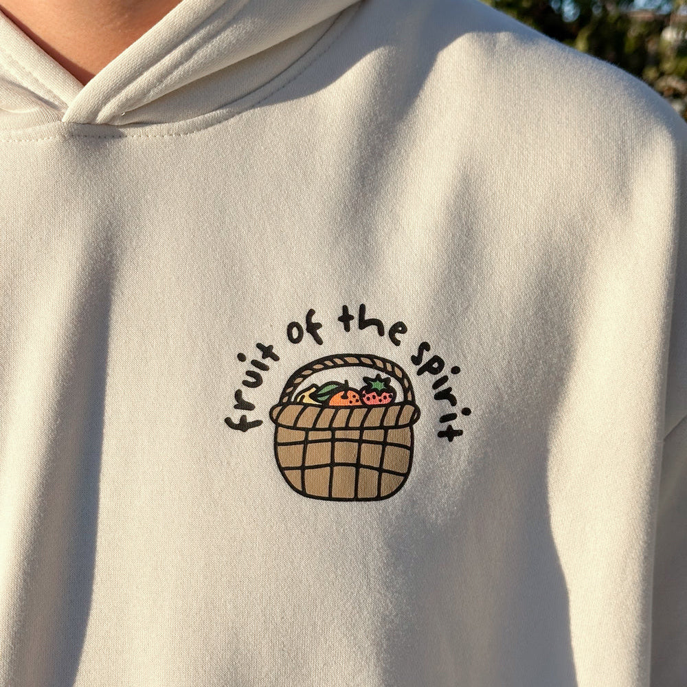 Light gray hoodie with 'fruit of the spirit' design on the chest.