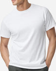 Male model wearing a classic white Gildan Heavy Cotton T-Shirt with a relaxed unisex fit, ideal for DTF printing and custom designs by Lumiere Vive.