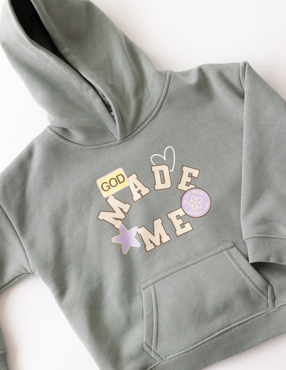 Millstone Grey God Made Me Kids Hoodie laid flat showing the front design and kangaroo pocket