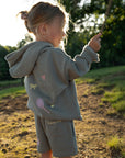 Child wearing Millstone Grey God Made Me kids shorts outdoors