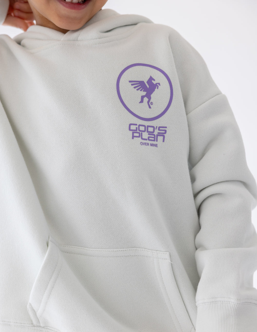 Close-up of the hoodie’s purple chest graphic and front pouch pocket.