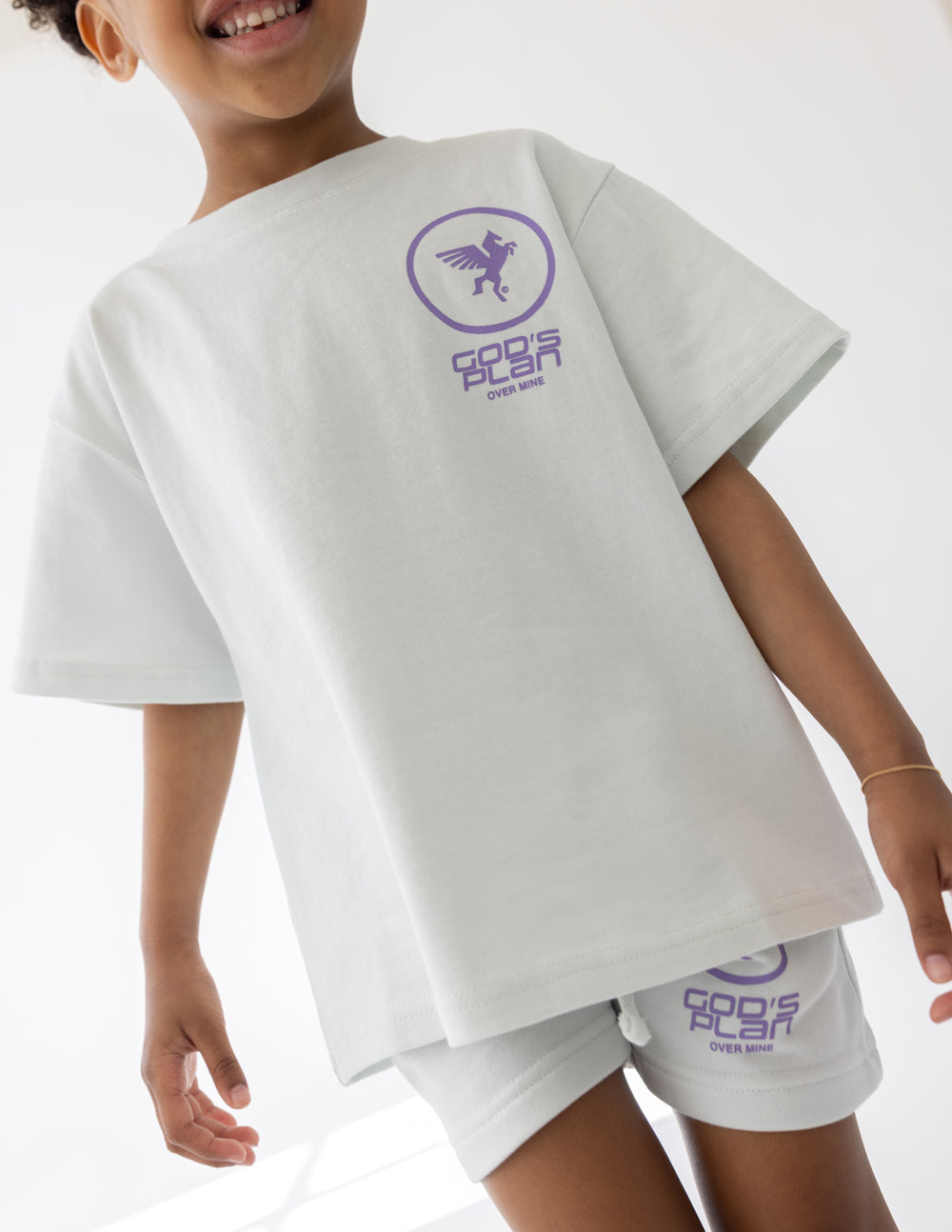 Angled front view of the oversized God’s Plan Racing Icicle kids tee
