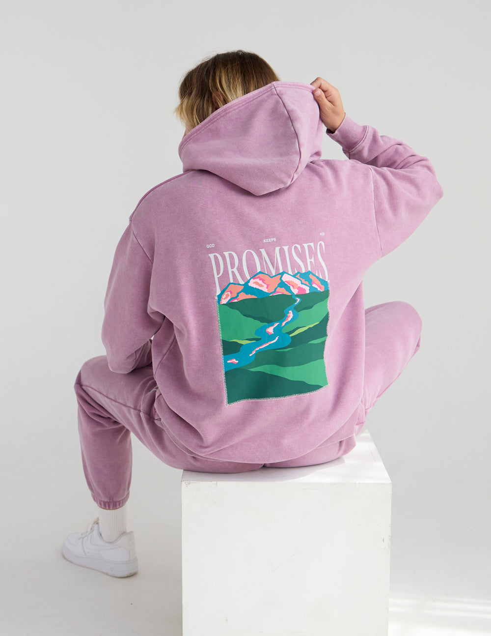 Studio back view of the Bordeaux God’s Promises Hoodie showing the landscape print and contrast stitching.