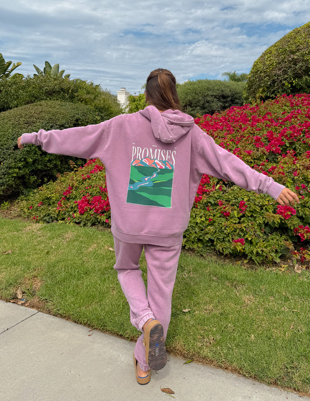 Back view of the Bordeaux God’s Promises Hoodie showing its colorful landscape graphic, styled with coordinating pants.