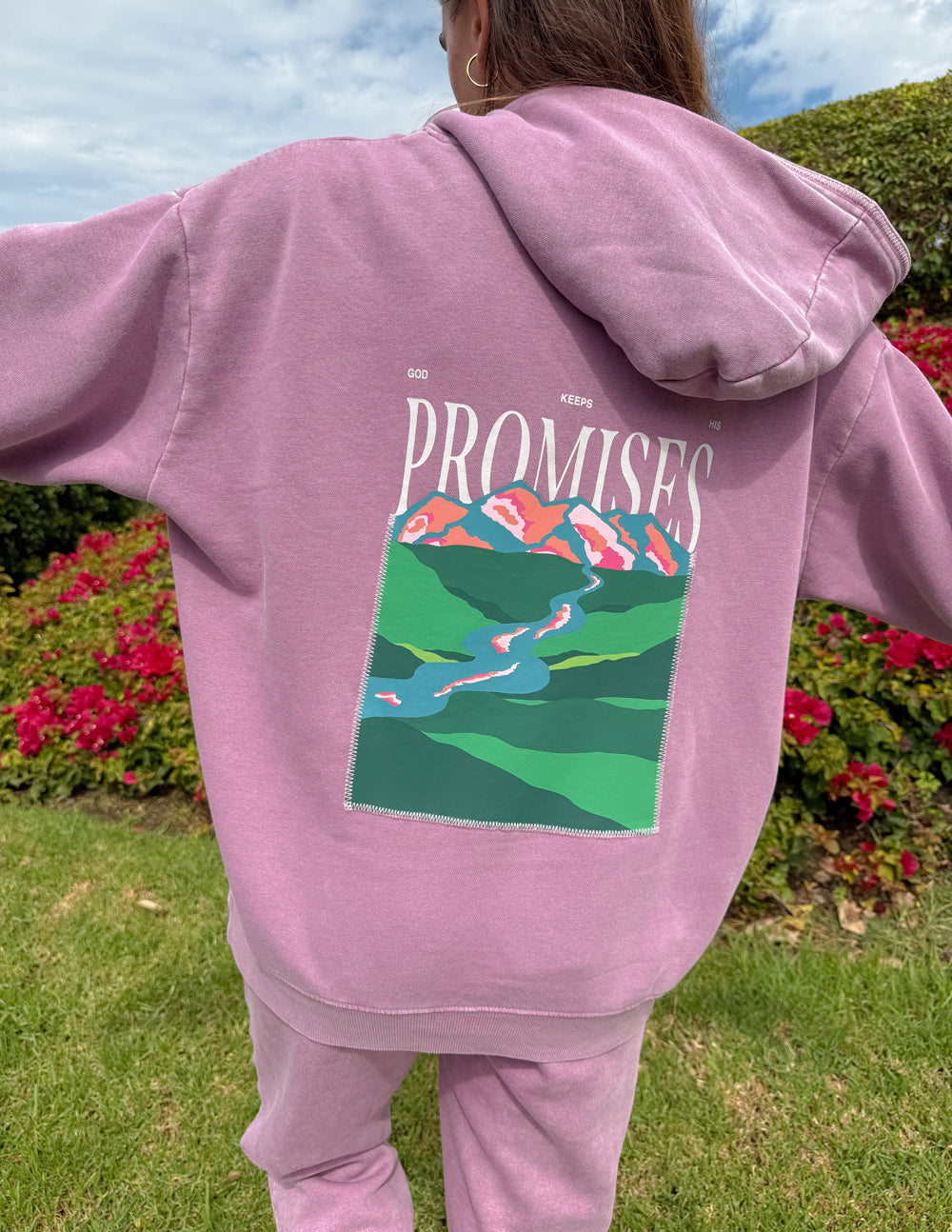 Close-up of the God’s Promises Hoodie back graphic with lettering above a colorful landscape.
