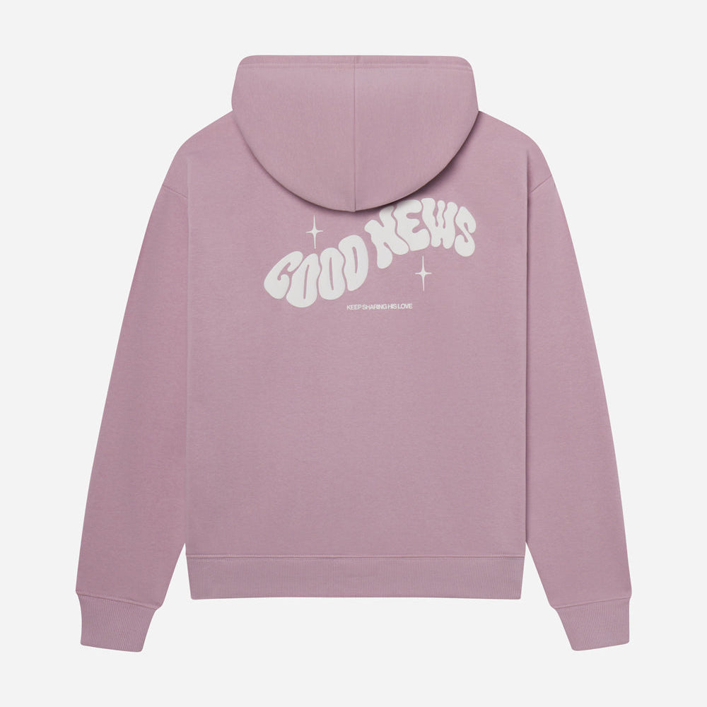 Pink hoodie with 'Good News' text on the back against a white background